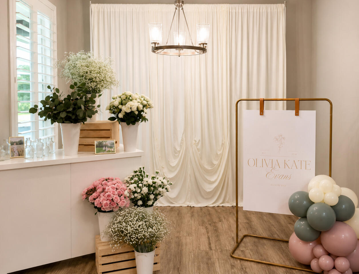 Draped Bloom Bar Backdrop Soft draping, floral styling, and custom signage combined to create a refined focal point for bridal showers, baby showers, and special celebrations.